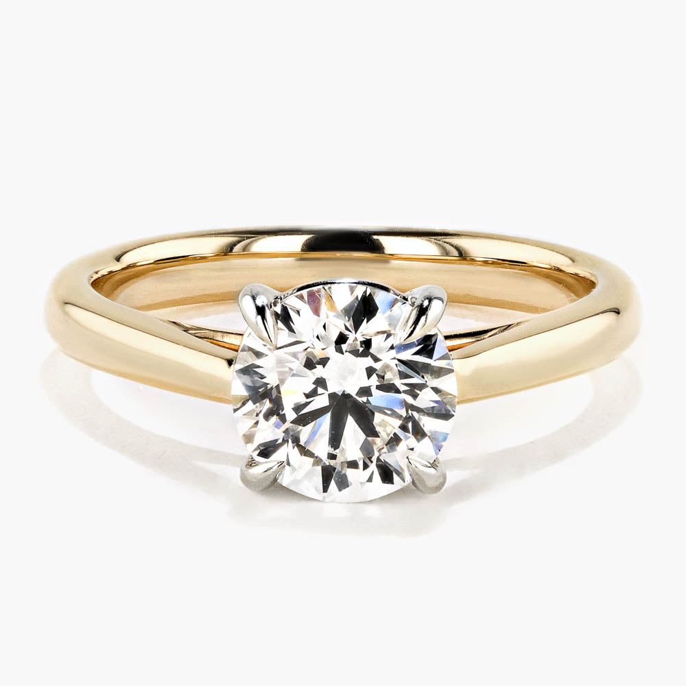 Shown in 14K Yellow Gold|cathedral solitaire engagement ring with round cut lab grown diamond center stone set in 14k yellow gold recycled metal by MiaDonna