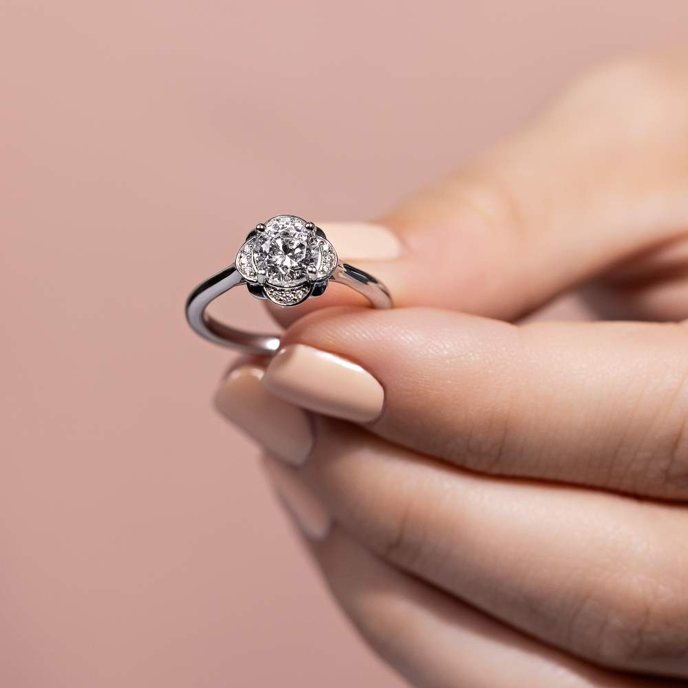 Shown here with a 1.0ct Round Cut Lab Grown Diamond center stone in 14K White Gold|nature inspired diamond halo engagement ring with round cut lab grown diamond center stone set in 14k white gold recycled metal