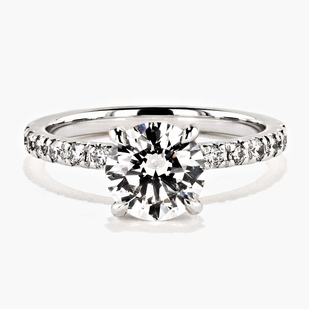 Shown in 14K White Gold|diamond accented engagement ring with round cut lab grown diamond center stone set in 14k white gold recycled metal by MiaDonna