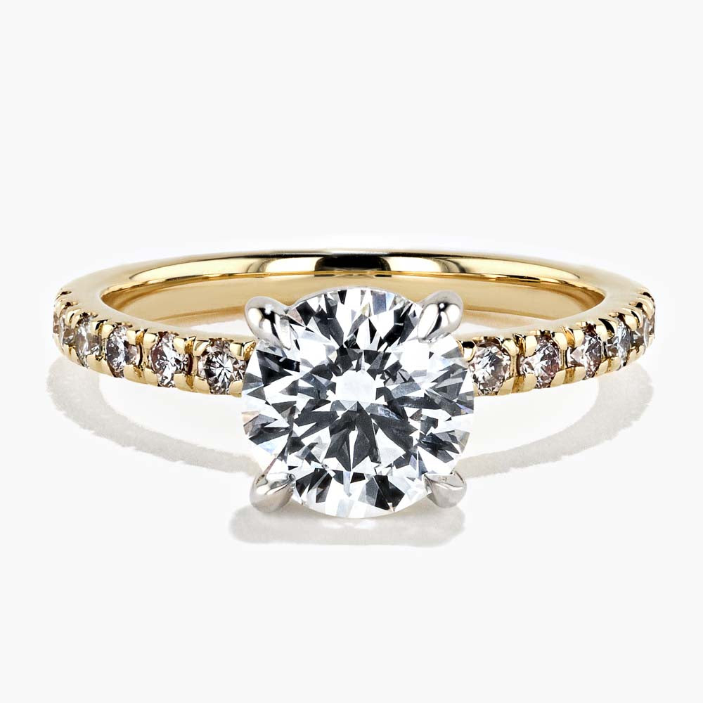 Shown in 18K Yellow Gold|diamond accented engagement ring with round cut lab grown diamond center stone set in 18k yellow gold recycled metal by MiaDonna