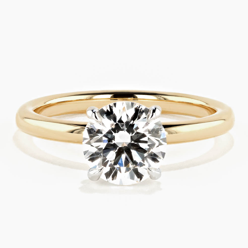 Shown in 18K Yellow Gold|solitaire engagement ring with round cut lab grown diamond center stone set in 18k yellow gold recycled metal by MiaDonna